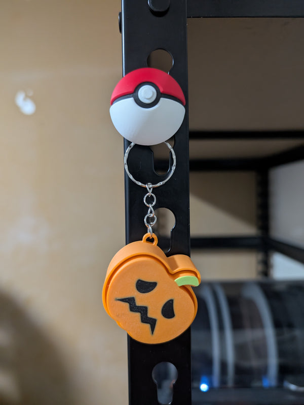 קליקר מחזיק מפתחות דלעת (עצובה)